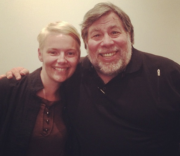 Picture of Abby smiling standing next to Steve Wozniak, also smiling. 