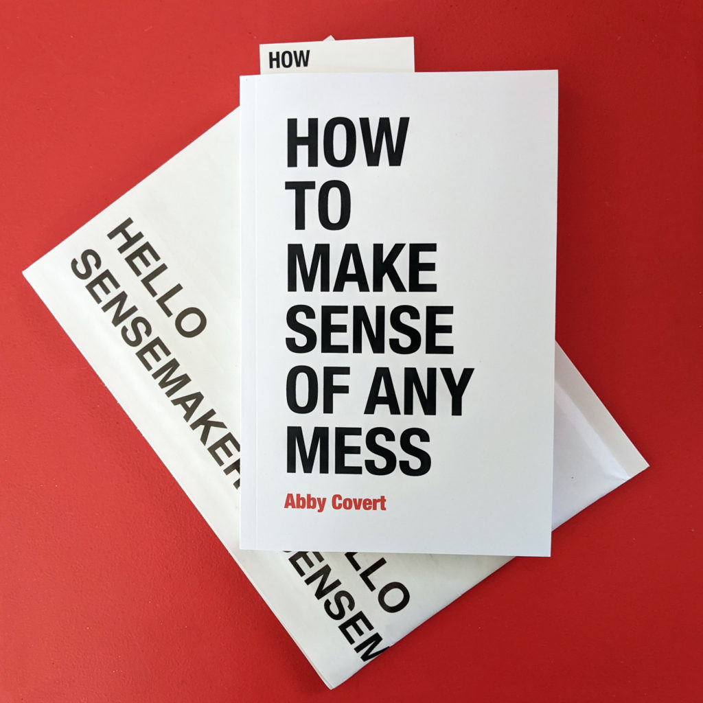 How to Make Sense of Any Mess (a book) in front of an envelop that says hello sensemaker. All Helvetica, all the time.